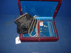 A maroon, leather covered jewellery box (some damage to lock) with inner tray/travel box,