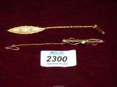 A Birmingham 15ct gold brooch with safety chain and a pretty gold coloured bar brooch with central