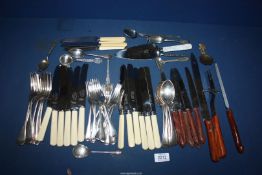 A quantity of cutlery to include; knives, forks,