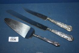 A Silver handled cake knife and slice, plus a bread knife in Kings pattern, Sheffield 1957,