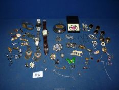 A quantity of costume jewellery including earrings, brooches etc.