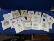 A quantity of Beatrix Potter books.
