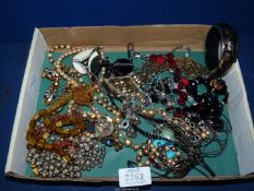 A quantity of costume jewellery including necklaces, bangles, etc.