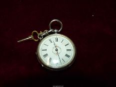 A ladies Swiss 800 silver cased pocket watch with floral and foliage engraved detail to the back,