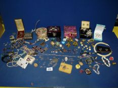 A quantity of costume jewellery including necklaces, clip-on earrings, jewellery boxes,