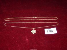 A handmade 9ct gold chain 15 1/2" long and a fine 9ct gold chain with filigree gold daisy set with