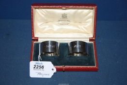 A pair of Silver napkin rings in presentation case, London, 1932, makers J.B.