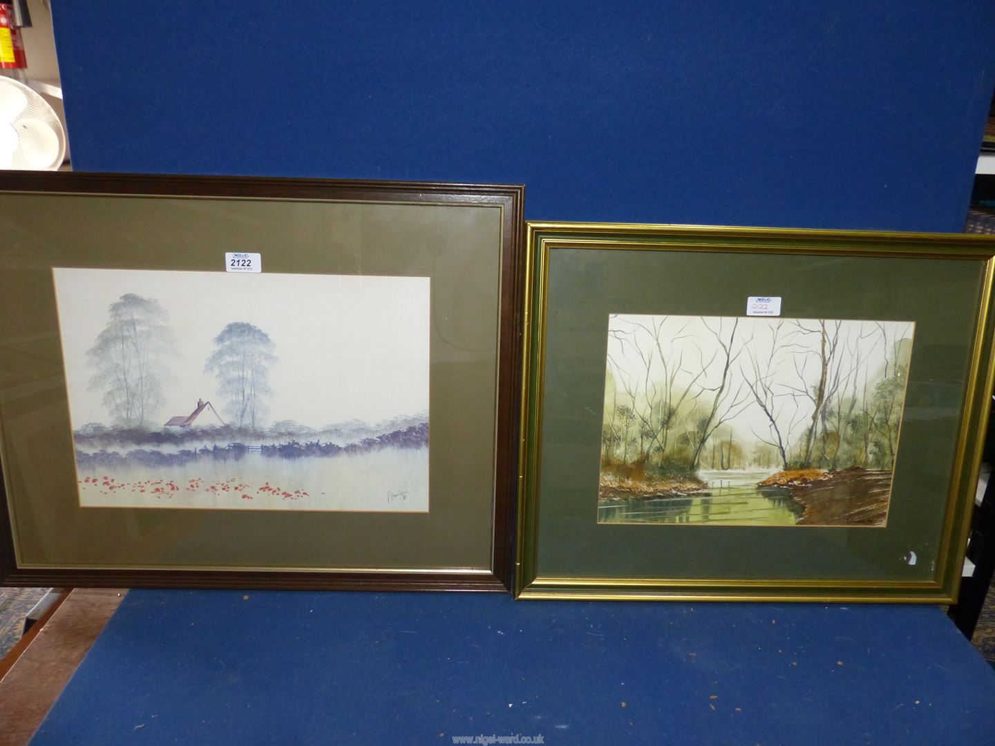 A framed and mounted Watercolour of a river landscape surrounded by woodland, signed lower right 'C.