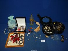 A jewellery box with contents to include dragon fly brooch, watches, chains, earrings, etc.