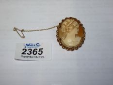 A Cameo brooch with gold rim.