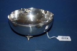 An Art Nouveau continental solid silver bowl standing on three scroll feet,