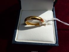 A 22ct gold Wedding band, size K, weight 7.5g.