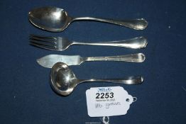 A silver butter knife, sauce ladle, dessert spoon and fork, all with hallmarks for Sheffield,