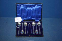 A cased set of Silver Teaspoons with sugar tongs, Sheffield 1914, makers James Deakin & Sons,
