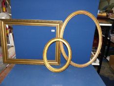 Three antique gilded picture frames.