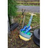 A garden sprayer, garden tools and a water gun.