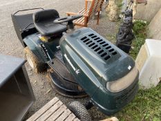 A Bolens ride-on-lawn mower with grass box, powered by a 12.