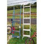Two step ladders; one six rung aluminum, one steel.