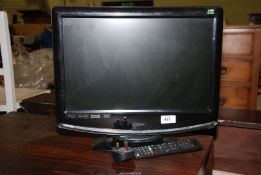 A Logic TV with remote, sold as seen.