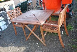 A patio table (35" square x 30" high) and two chairs.