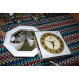 A EME wall clock and a small octagonal mirror