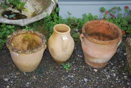 Three terracotta planters.