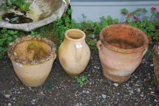 Three terracotta planters.