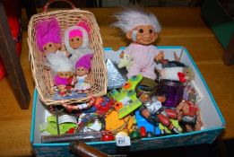 A box of assorted toys,and a box of Trolls.