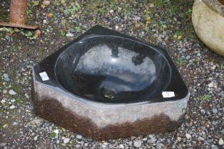 A polished granite sink, 20 1/4" x 6" deep.