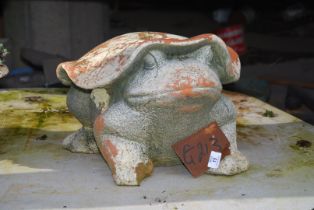 A frog garden ornament.