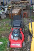 A 'Laser Omega 53' propelled lawn mower with Honda 4.5 engine and grass box - good compression.