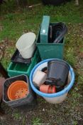 Plastic pots and irrigation pipe.