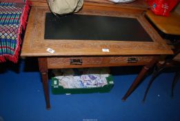 A small table with two drawers and having a leather centre 37" x 21" x 30" tall.