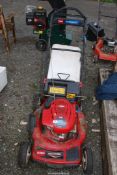 A 'Toro' propelled mower with 'Briggs and Stratton' engine - engine turns