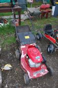 A propelled mower with grass collector with Honda engine - Good compression.