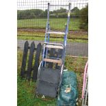 Two step ladders; one metal five rung, one two rung plastic footed.