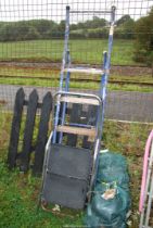 Two step ladders; one metal five rung, one two rung plastic footed.
