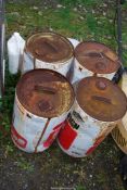 Drums containing damp proofing and jugs.