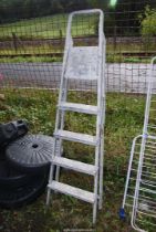 A five rung aluminium step ladder.