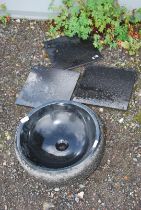 A black circular sink, 16" diameter x 6" deep plus three black granite 12" tiles.