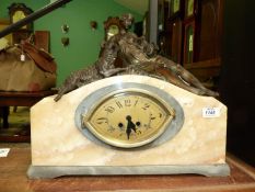 An elegant Art Deco French grey and cream marble cased mantel clock having an elliptical face with