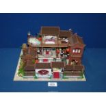 An illuminated Chinese diorama of Chinese house, 12 1/2'' x 9 1/2'' x 6 1/2'' high.