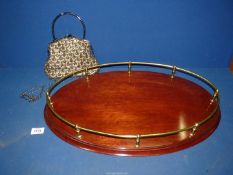 A wooden galleried tray and a beaded handbag.
