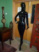 A black gloss full body shop mannequin, 74" tall. N.B.