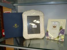 Tuptonware and Belleek Claddagh ivory picture frames with gold trim.