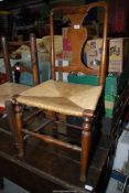 An elegant Oak and other woods Side Chair having an urn shaped splat,
