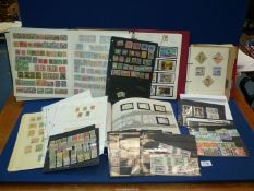 Four stamp Albums and stamps on sheets/cards, includes China, etc.