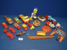 A quantity of toys including tinplate wind-up helicopter a/f, fire engines,