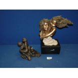 A Regency Fine Arts 'Youth' figure, 10" wide x 11 1/2" high and a composite figure of two lovers,