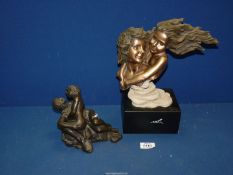 A Regency Fine Arts 'Youth' figure, 10" wide x 11 1/2" high and a composite figure of two lovers,